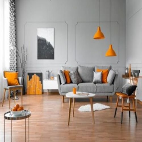 Contemporary Living Room Design with Grey Sofa and Orange Accent Chair