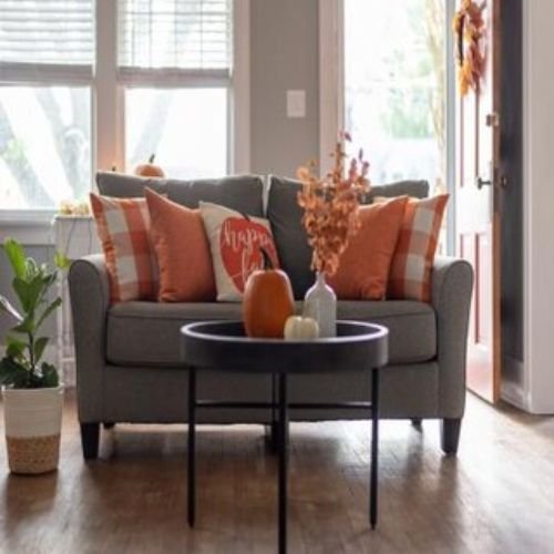 Contemporary Living Room Design with Grey Sofa and Orange Accent Chair