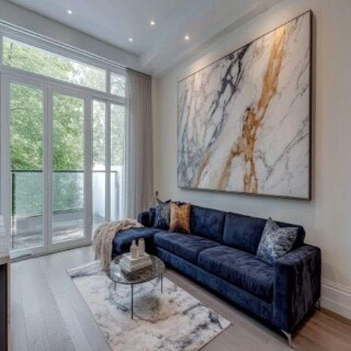 Modern Living Room Design with Dark Blue L-Shaped Sofa and Marble Table